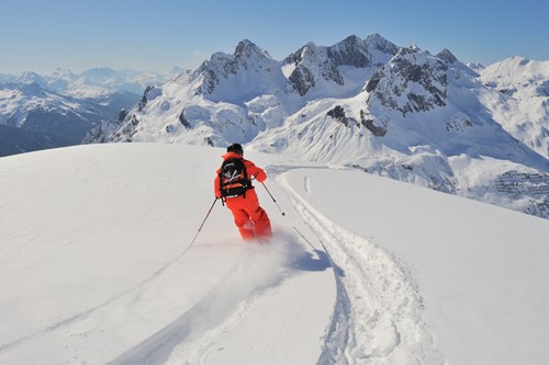 lech zurs freeriding skier fresh tracks
