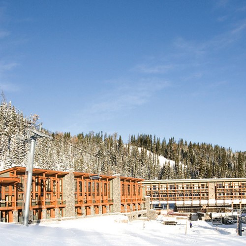 Sunshine Mountain Lodge - snowy exterior of ski accommodation in Canada