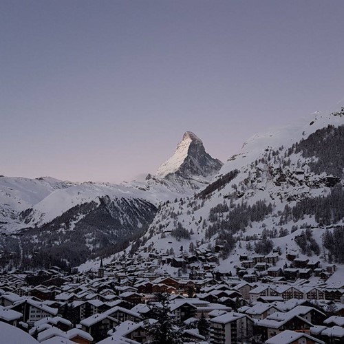 snow on the rooves in from of the matterhorn in Zermatt
