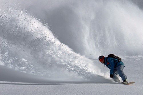 Skiing-in-powder-book-early