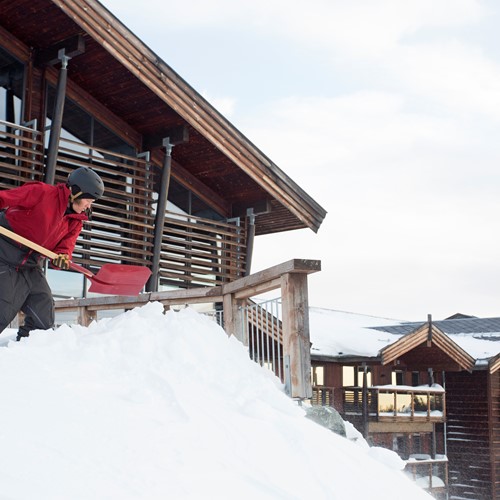 shovelling snow outside the Norefjell ski & spa hotel-Norway