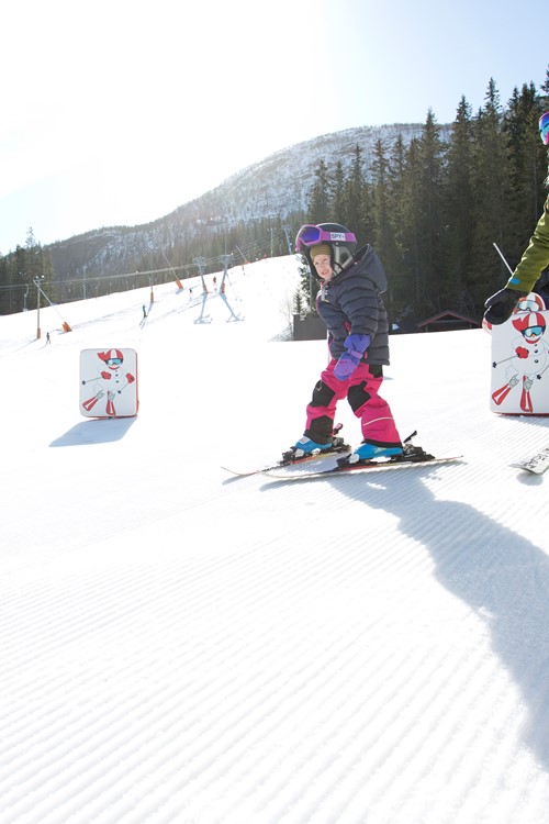 teaching children to ski in Hemsedal ski resort, Norway