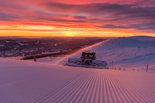 Trysil-Norway skiing holidays-piste machine grooming the runs at sunset
