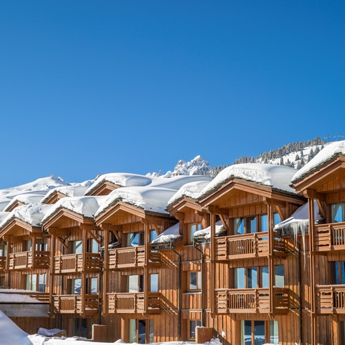 Les-Chalets-du-Forum-Courchevel-1850-exterior apartments in snow