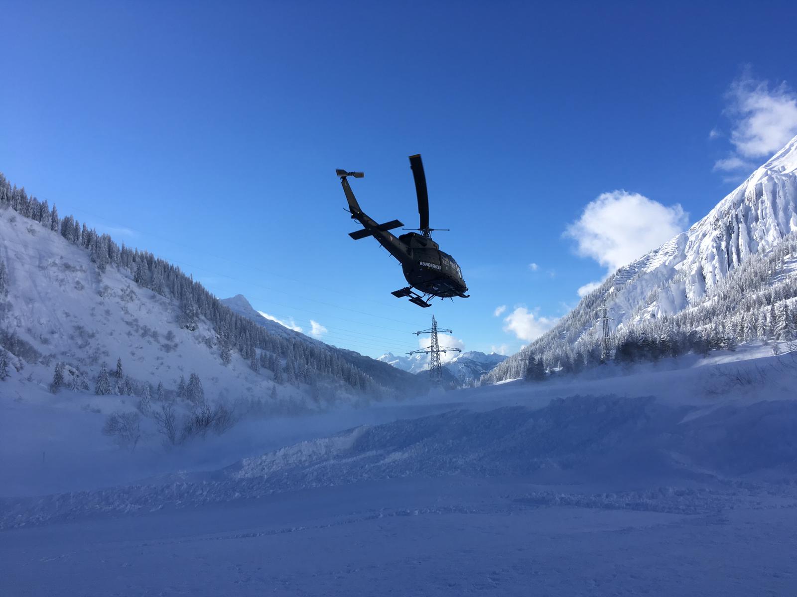 helicopter taking supplies to places cut off by snow in Austria near Stuben