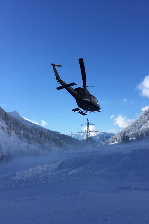 helicopter taking supplies to places cut off by snow in Austria near Stuben