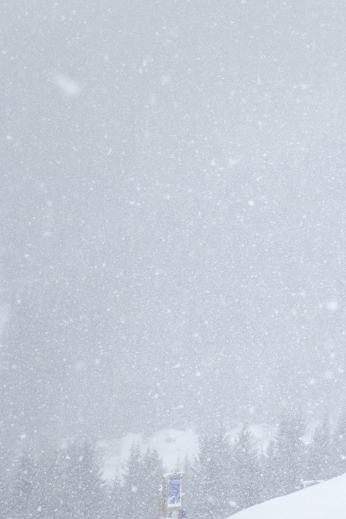 meribel france snowboarder in snowfall on mountain