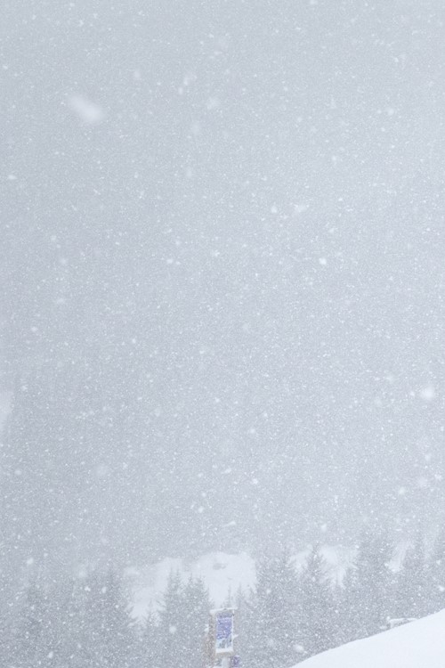 meribel france snowboarder in snowfall on mountain