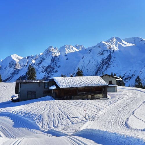 la clusaz mountain hut bluebird day winter