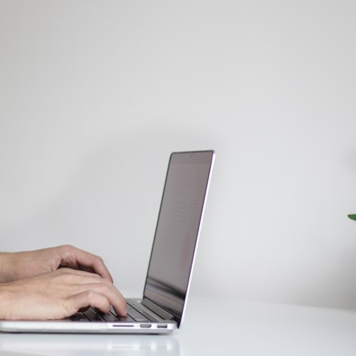 computer laptop person typing on desk