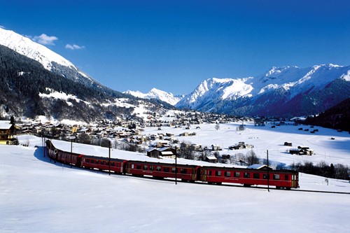Snow train through the white valley of Klosters in Switzerland