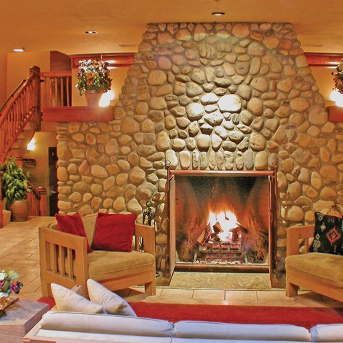 Banff Caribou Lodge & Spa, cosy fire in reception - ski hotel in Canada