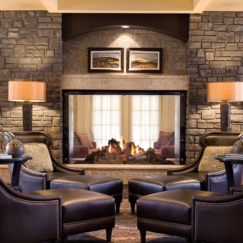 Fairmont Banff Springs, ski hotel in Canada - lounge with luxury fire