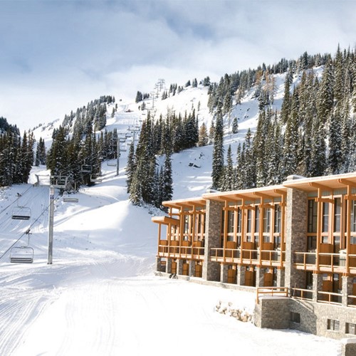 Sunshine Mountain Lodge - snowy exterior of ski accommodation in Canada