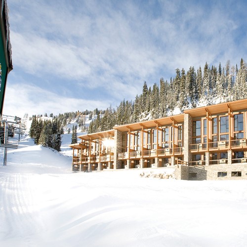 Sunshine Mountain Lodge - snowy exterior of ski accommodation in Canada