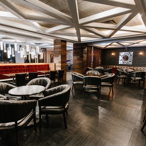 Elk + Avenue Hotel, contemporary ski hotel in Banff - bar and seating area