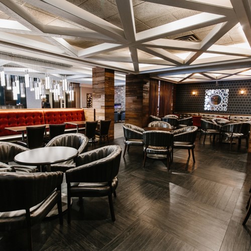 Elk + Avenue Hotel, contemporary ski hotel in Banff - bar and seating area