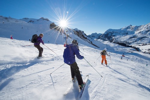 La Clusaz ski weekends France group skiers downhill in valley