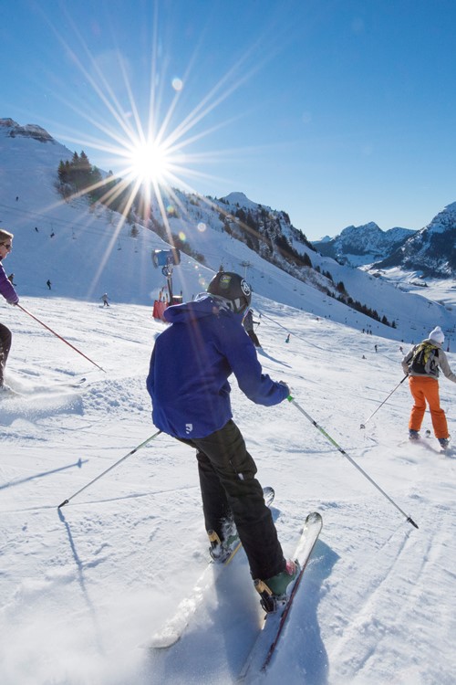 La Clusaz ski weekends France group skiers downhill in valley