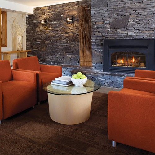 Banff Aspen Lodge, ski hotel in Banff, Canada - lounge and seating by fire
