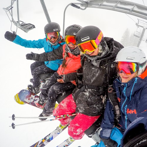 chairlift snowing mates
